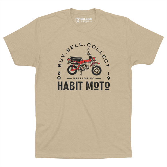Cream colored Habit Moto shirt with orange motorcycle on chest. Has arch around motorcycle that says "buy, sell, collect".