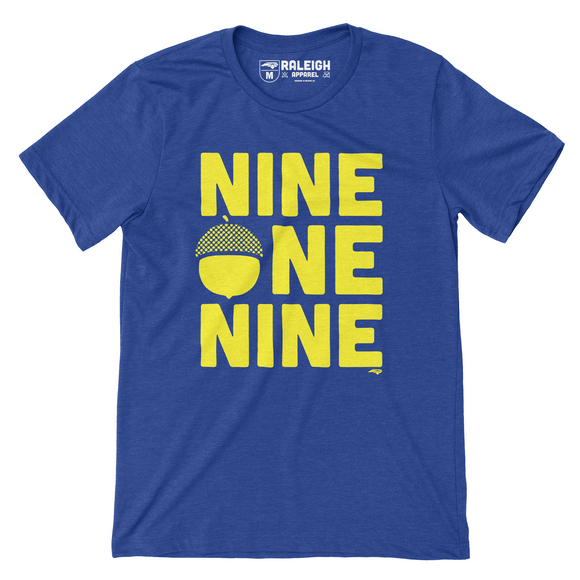 Royal blue colored shirt that says nine one nine across the chest in large yellow print. An acorn has replaced the O in one.