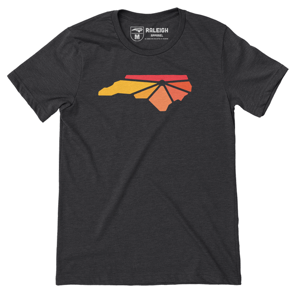 Charcoal colored t-shirt with Raleigh Apparel logo on chest in warm colors.