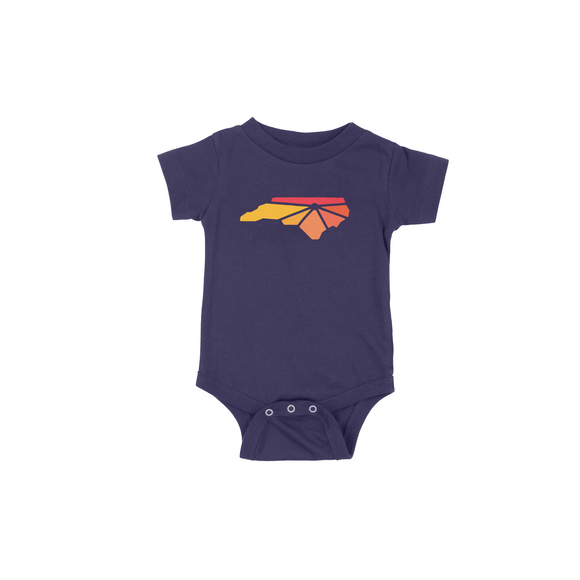Navy onesie with Raleigh Apparel logo in warm colors