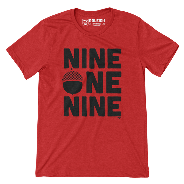 Red colored shirt that says nine one nine across the chest in large black print. An acorn has replaced the O in one.