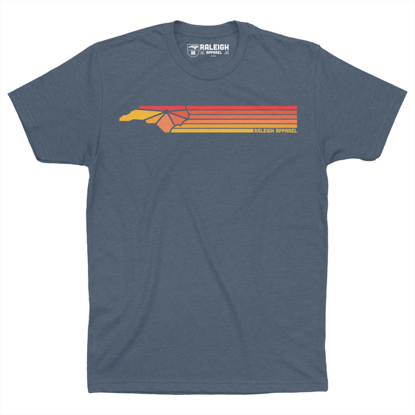 Indigo colored t-shirt with Raleigh Apparel logo in warm colors followed by colorways across the chest.