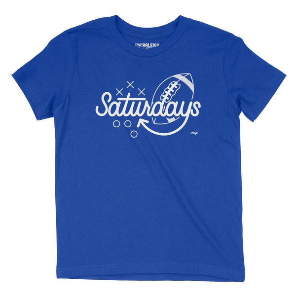 True royal blue youth t-shirt with the word Saturdays in white and white football behind the letters  D A Y S